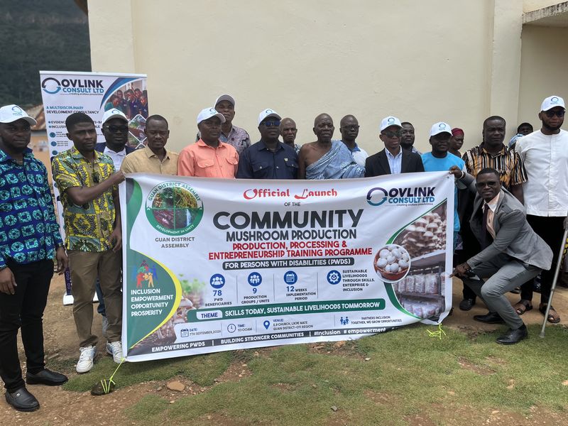 Officials, traditional leaders and beneficiaries standing behind the programme launch banner