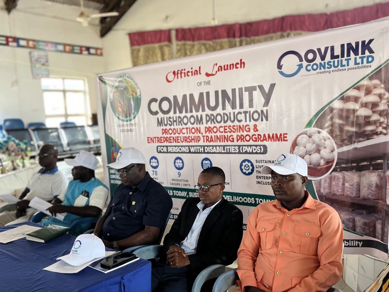 Assembly officials and partners seated during the launch ceremony beneath the programme banner