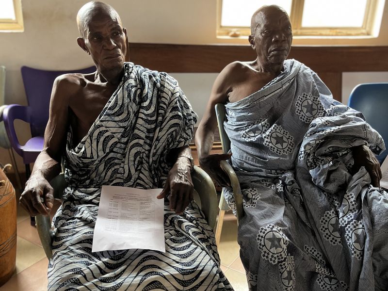 Two traditional leaders in kente seated at the launch ceremony